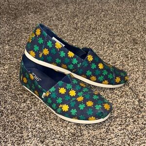 Toms Blue Slip-Ons with Green and Yellow Shamrock Design